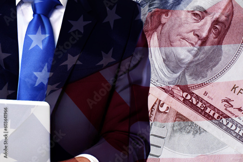 Double exposure American businessman use laptop on USA flag and money background.