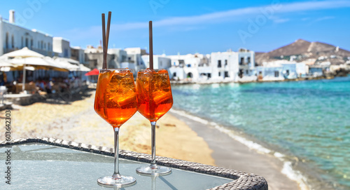 two aperol spritz on a summer evening in a mediterranean restaurant photo