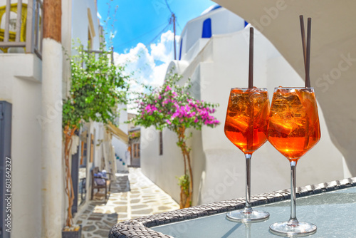 Two Aperol Spritz  in a traditional village on a Greek island of the Cyclades photo