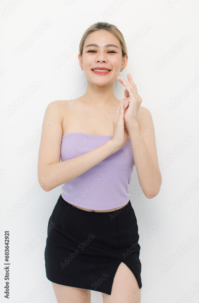 Portrait isolated cutout closeup shot of millennial Asian young beautiful sexy long hair model in seamless tube cropped top standing posing crossed arms look at camera on white background copy space