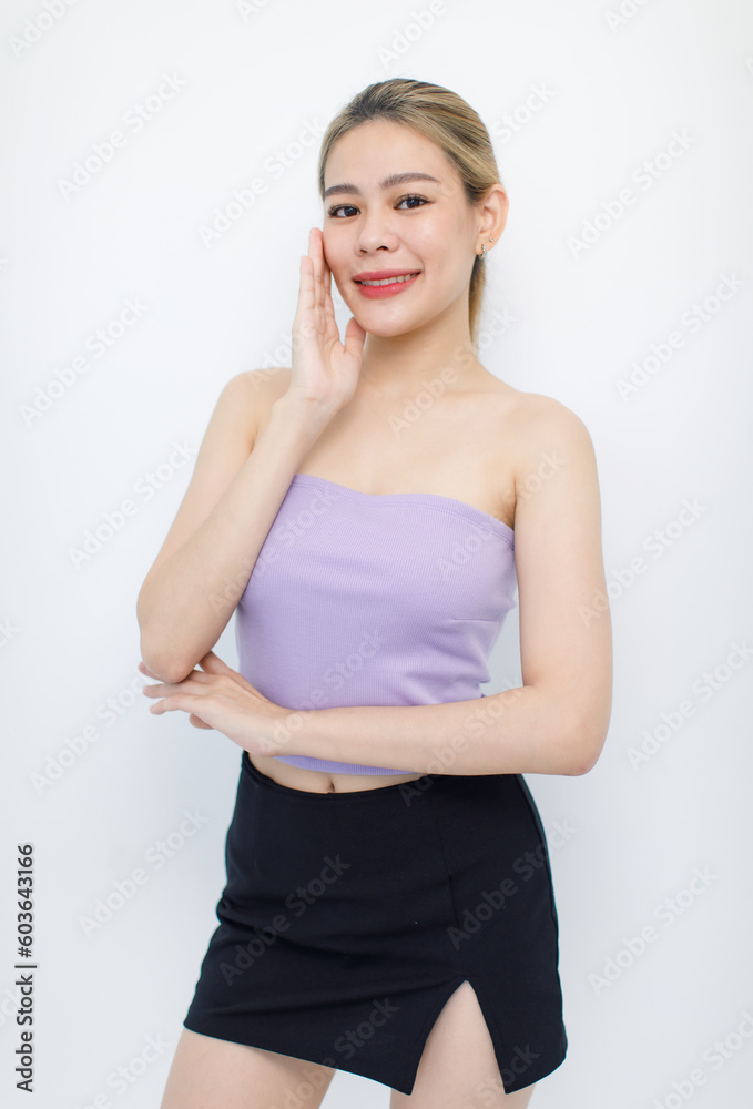 Portrait isolated cutout closeup shot of millennial Asian young beautiful sexy long hair model in seamless tube cropped top standing posing crossed arms look at camera on white background copy space Portrait isolated cutout closeup shot of millennial Asian young beautiful sexy long hair model in seamless tube cropped top standing posing crossed arms look at camera on white background copy space