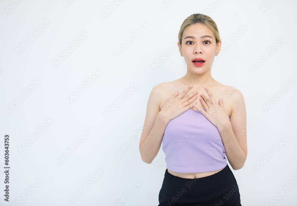 Portrait isolated cutout studio shot of Asian beautiful shocked surprised amazed female model in tube cropped top casual shirt holding hands on chest open mouth on white background with copy space Portrait isolated cutout studio shot of Asian beautiful shocked surprised amazed female model in tube cropped top casual shirt holding hands on chest open mouth on white background with copy space