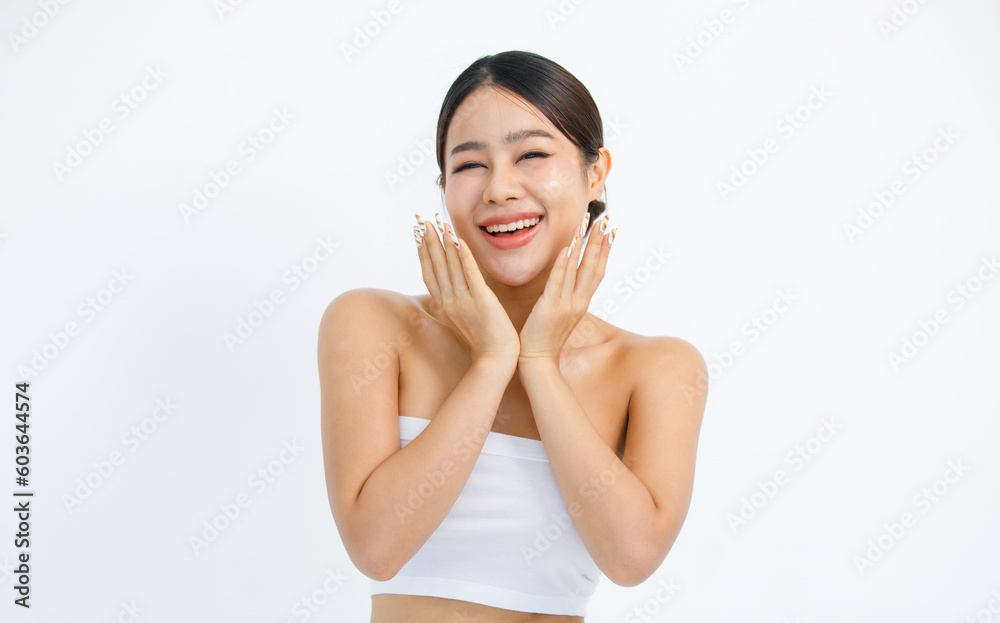 Isolated cutout studio shot millennial Asian beautiful pretty sexy female model in tube cropped top shirt standing smiling holding hand on face showing presenting painting nails on white background Isolated cutout studio shot millennial Asian beautiful pretty sexy female model in tube cropped top shirt standing smiling holding hand on face showing presenting painting nails on white background