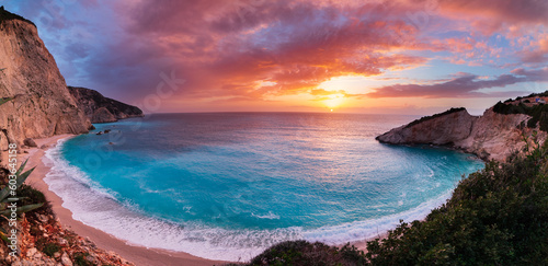 Beautiful beach and water bay in the greek spectacular coast line. Sunset gorgeous sky over blue water unique rocky cliffs. Greece summer top travel destination Lefkada island