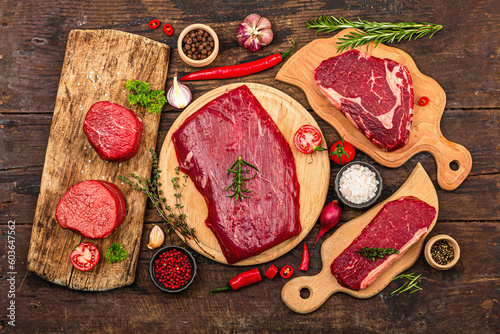 Photos Set of various steaks with spices