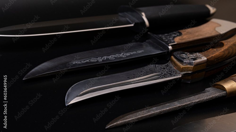 Damascus steel knives on a black background. Kitchen knives. background with japanese knife. A set of Japanese Damascus steel knives. Banner Damascus steel knives on a black background. Kitchen knives. background with japanese knife. A set of Japanese Damascus steel knives. Banner