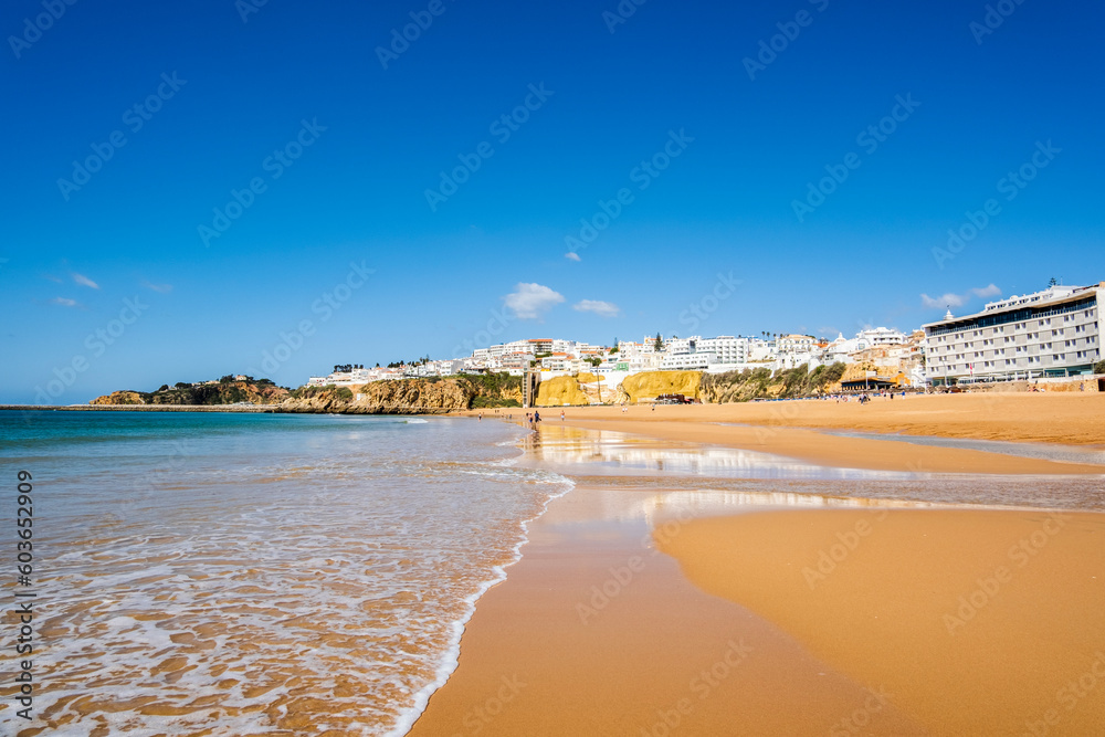 Great view of Fisherman Beach, Praia dos Pescadores, with whitewashed houses on cliff, Albufeira, Algarve, Portugal