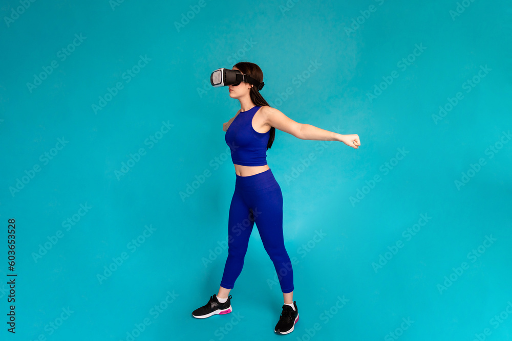 Woman jumping while wearing vr glasses.