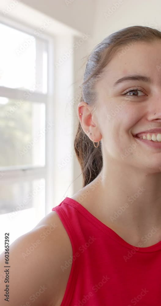 Vertical video half portrait of happy unaltered caucasian woman at gym smiling in slow motion Vertical video half portrait of happy unaltered caucasian woman at gym smiling in slow motion