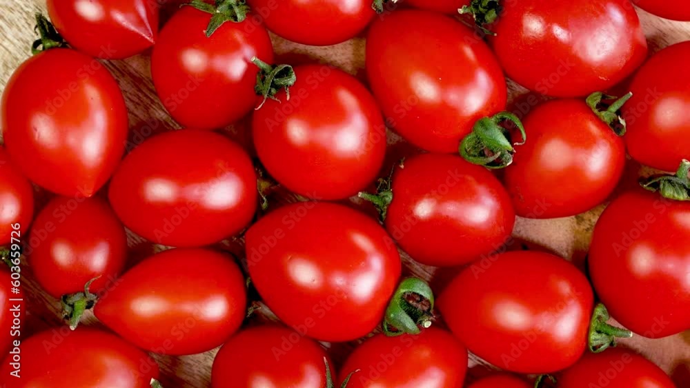 Visual appeal red juicy cherry tomatoes rotates as solid backdrop vivid colors. Visual appeal red juicy cherry tomatoes rotates as solid backdrop vivid colors.