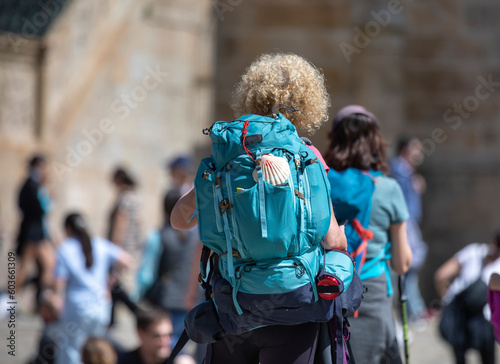 Schilderij op canvas Pilgrims from the Camino de Santiago arrive at the Plaza del Obradoiro because t