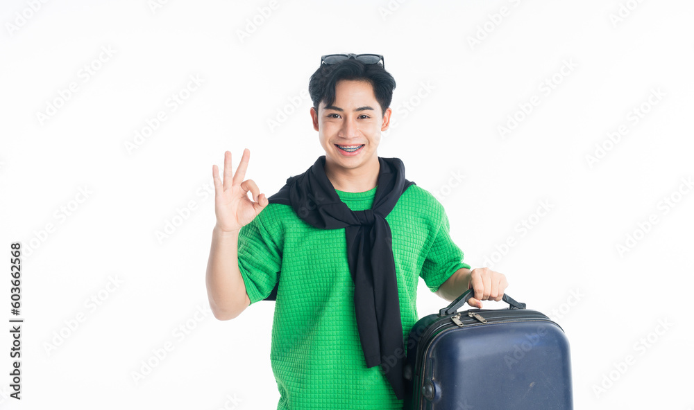 raveler tourist happy man holding luggage okay ok gesture isolated on white background. raveler tourist happy man holding luggage okay ok gesture isolated on white background.