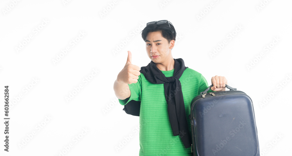 Traveler handsome man holding a suitcase over isolated white background with thumbs up gesture and smiling Traveler handsome man holding a suitcase over isolated white background with thumbs up gesture and smiling