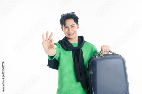 raveler tourist happy man holding luggage okay ok gesture isolated on white background.