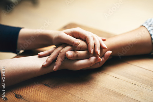 Photography Holding hands, cancer and support of friends, care and empathy together on table in home mockup
