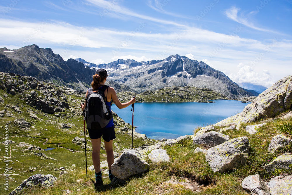 Young hiker girl summit to Montardo Peak in AIguestortes and Sant Maurici National Park, Spain Young hiker girl summit to Montardo Peak in AIguestortes and Sant Maurici National Park, Spain