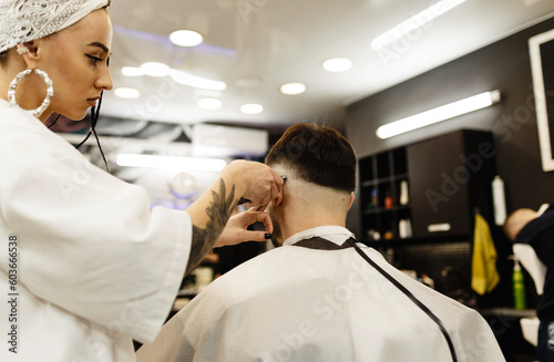 Men s haircut in a barber shop. Men s hair salon. Barbershop