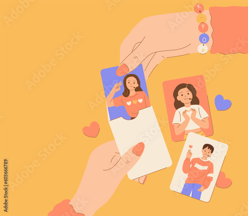 Female hands open a k-pop idol photo card.