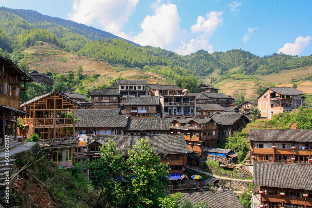 longsheng village in the mountains amongst rice terraces