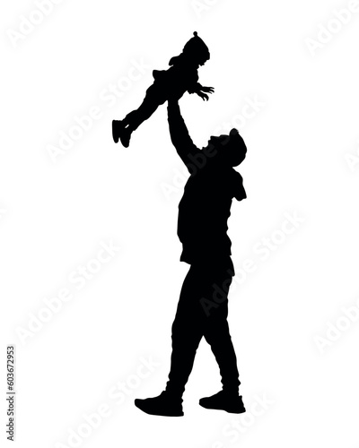 Young father lifting his baby up high in the air silhouette.