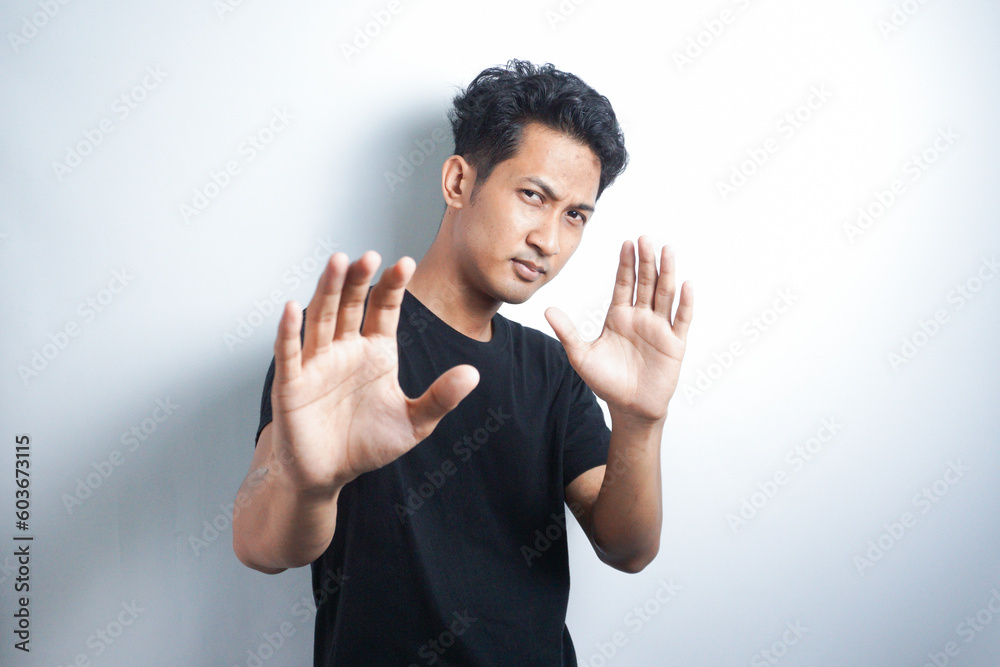 Stay away from me, dont come closer. Portrait of disgusted young asian guy step back and defend himself, pull away from disgusting creepy thing, grimacing displeased, express dislike Stay away from me, dont come closer. Portrait of disgusted young asian guy step back and defend himself, pull away from disgusting creepy thing, grimacing displeased, express dislike