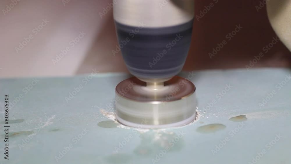 Drilling a hole in a tile with a special drill Drilling a hole in a tile with a special drill