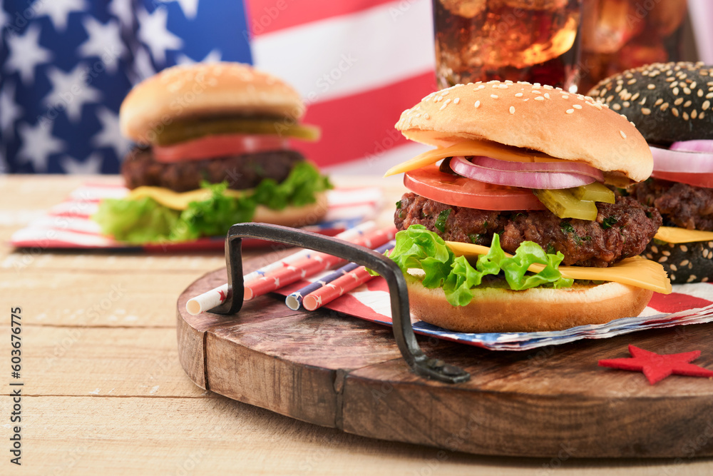4th of July American Independence Day traditional picnic food. American Burger and cocktail, American flags and symbols of USA Patriotic picnic holiday on white wooden background. Top view - obrazy, fototapety, plakaty 