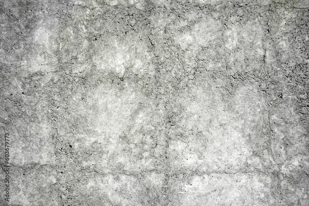 Gray concrete wall, close-up texture, rough surface with cracks creates a natural abstract pattern Gray concrete wall, close-up texture, rough surface with cracks creates a natural abstract pattern