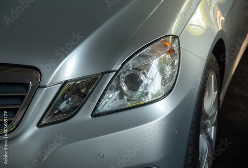 electric vehicle headlights energy saving technology isolated from the background © chalermphon