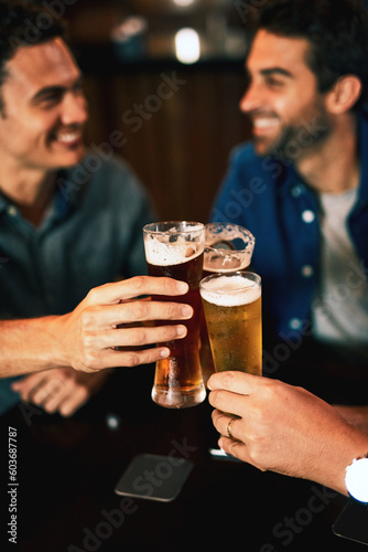 Beer, cheers and man hands drinking with friends at social event in a restaurant with happiness. Alcohol, glasses and toast at a pub at happy hour with smile and talk with drinks and celebration