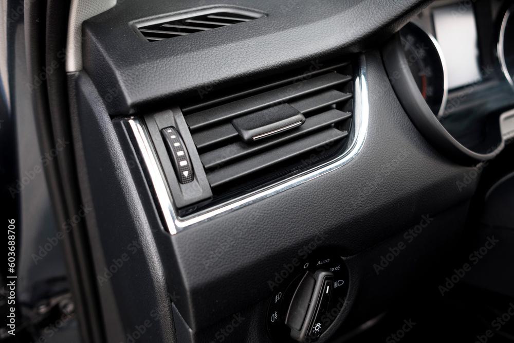 The modern interior of the car is black. Interior details.