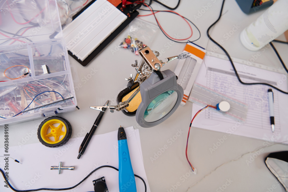 Various components and installations for robot fabrication fill the space, representing the intricate blend of technology, engineering, and innovation involved in the development and assembly of Various components and installations for robot fabrication fill the space, representing the intricate blend of technology, engineering, and innovation involved in the development and assembly of