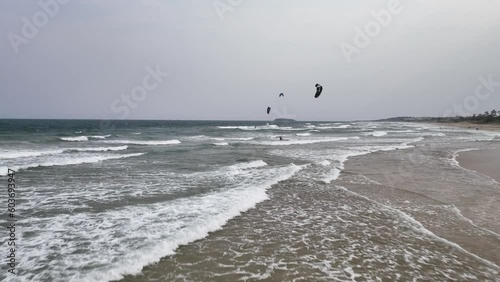 Soaring Heights: Aerial Survey of Kitesurfers Catching Air and Riding Waves