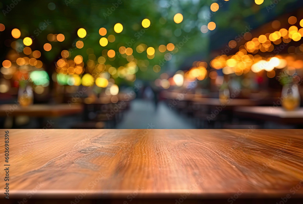 Empty wooden table and abstract blurred background of coffee shop or restaurant outdoor.
