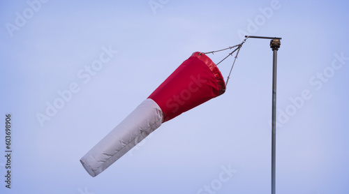 Windsock in the wind.  wind direction.  intensity of winds , wind speed  photo