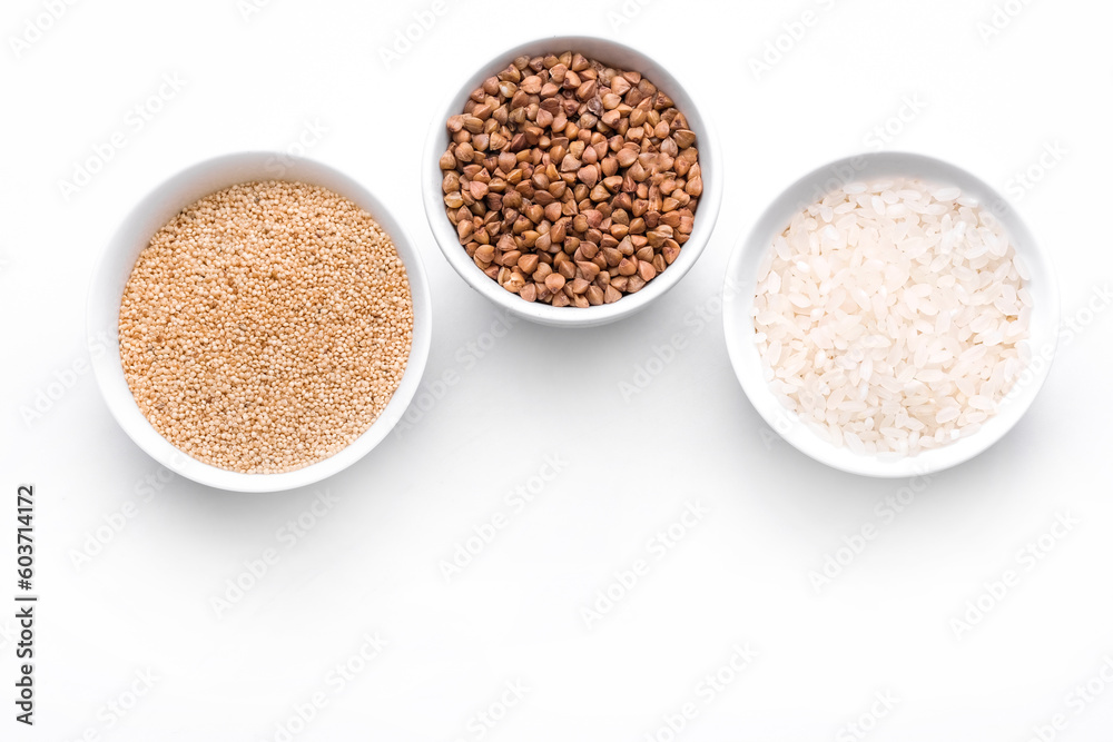 Rice, buckwheat, amaranth seeds. Gluten free seeds in bowls. Top view with copyspace. Rice, buckwheat, amaranth seeds. Gluten free seeds in bowls. Top view with copyspace.