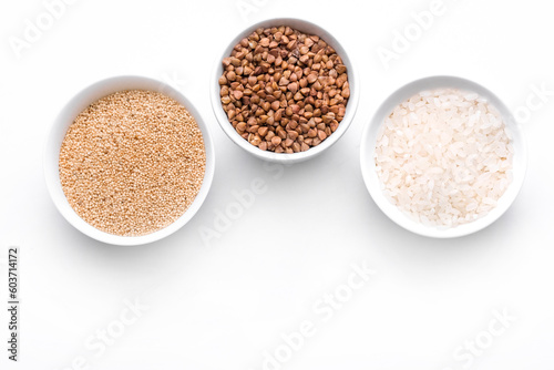 Rice, buckwheat, amaranth seeds. Gluten free seeds in bowls. Top view with copyspace.