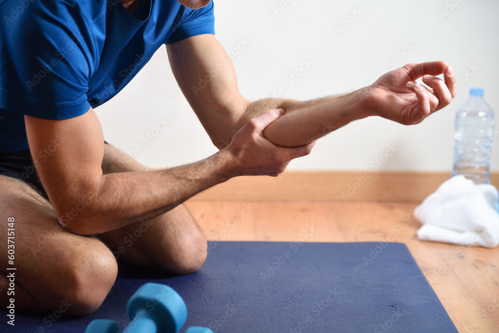Detail of man doing sports with forearm pain