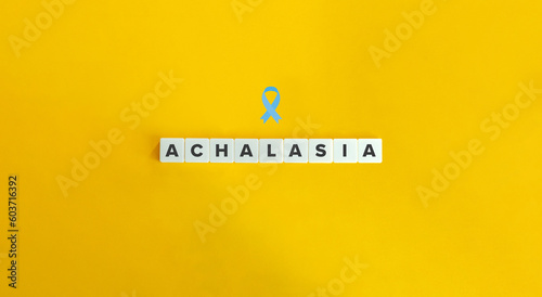 Achalasia Word with Pale Blue Awareness Ribbon.
Letter Tiles on Yellow Background. Minimal Aesthetics. photo
