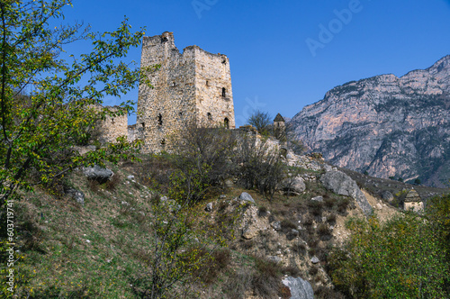 Ruins of an ancient city high in the mountains. Medieval towers built of stone to protect against attacks. A fortress for protection. The city of Egikal in Ingushetia. Battle towers with loopholes. © Eduard Belkin