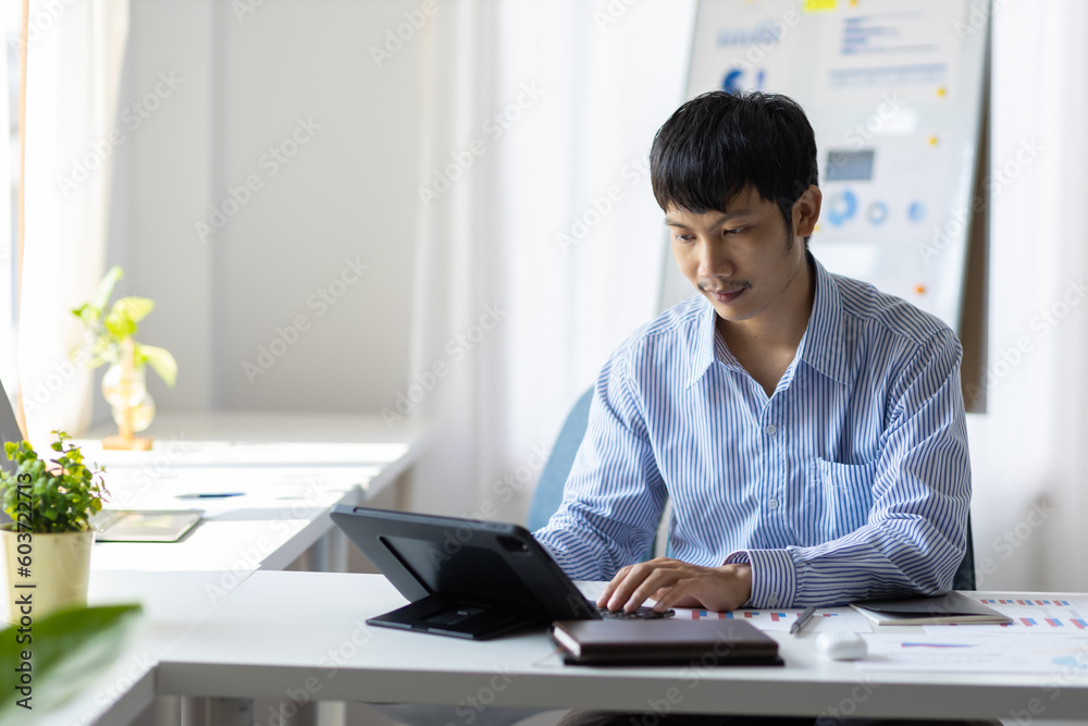 Businessman in casual clothes working alone in the office. Businessman in casual clothes working alone in the office.