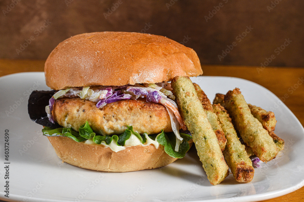salmon burger top with cole slaw