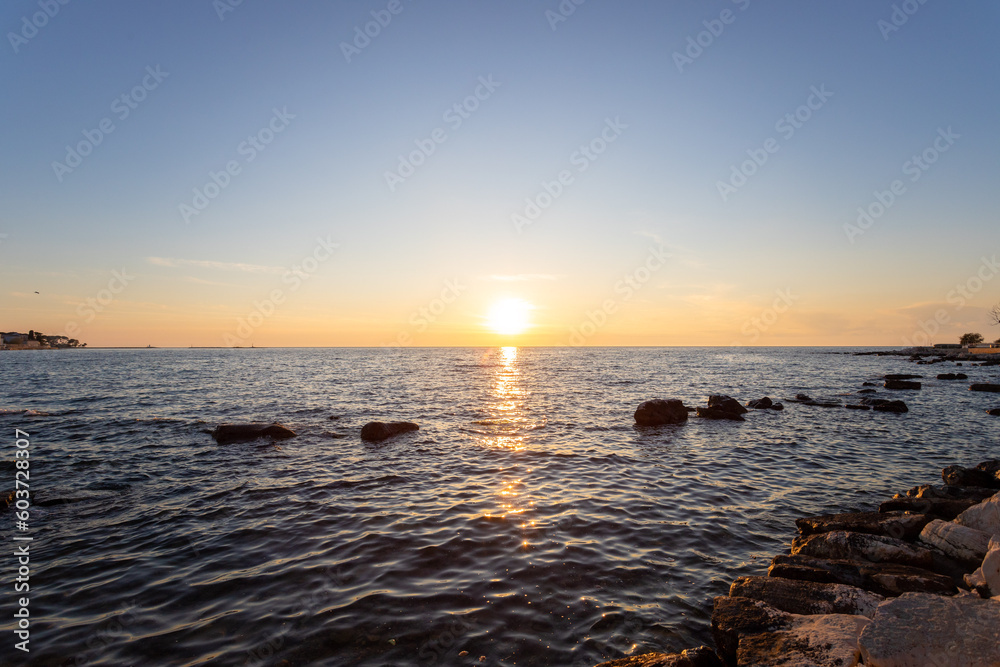 Scenic sunset at Porec beach, Croatia Scenic sunset at Porec beach, Croatia