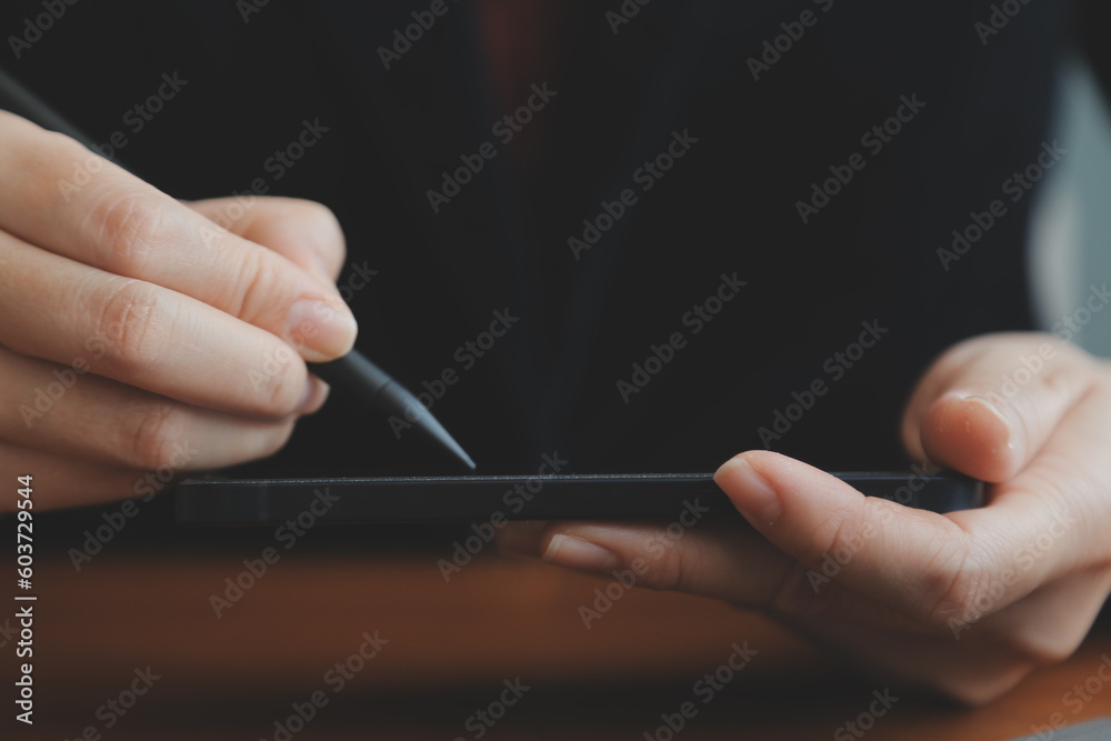 Asian Businesswoman Using laptop computer and working at office with calculator document on desk, doing planning analyzing the financial report, business plan investment, finance analysis concept. Asian Businesswoman Using laptop computer and working at office with calculator document on desk, doing planning analyzing the financial report, business plan investment, finance analysis concept.