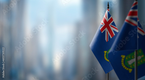 Small flags of the British Virgin Islands on an abstract blurry background