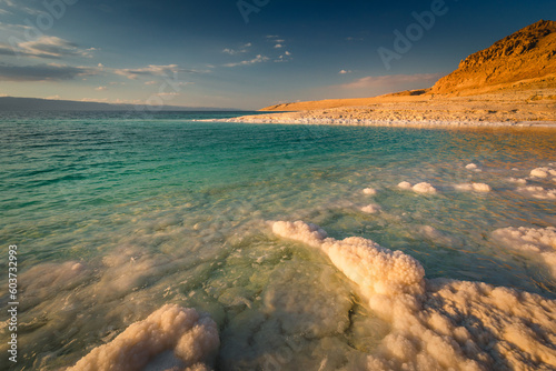 Landscapes from the Dead Sea in the light of the golden hour - interesting salt formations make an amazing impression.