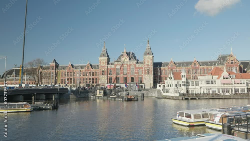 Canal and central station in Amsterdam 4k Canal and central station in Amsterdam 4k