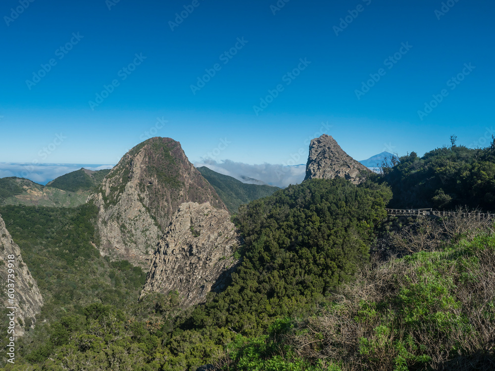 Scenic view from the Mirador del Bailadero with volcanic rock formations Los Roques and island Tenerife and Volcano Pico de Teide. Garajonay National Park on La Gomera, Canary Islands, Spain, Europe.