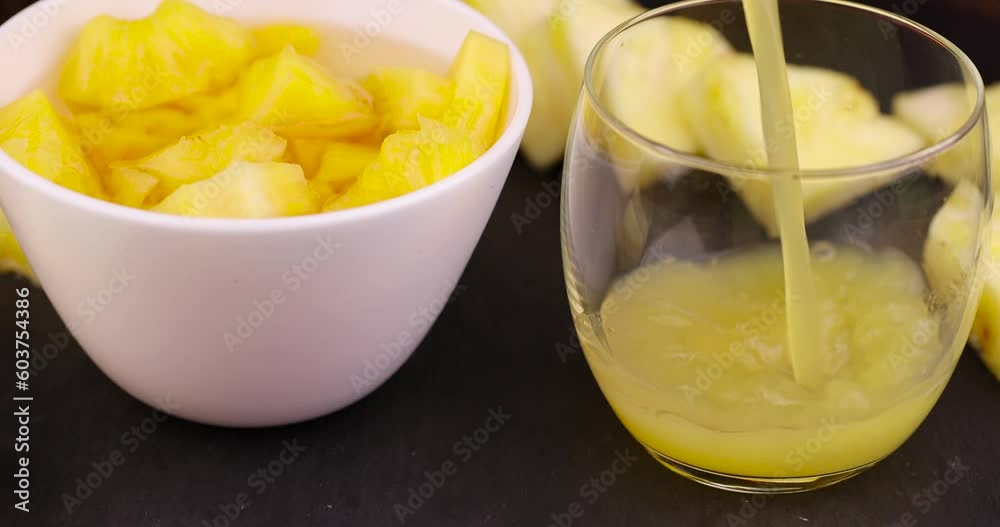 pineapple juice poured into a glass glass, cooking food and drinks from pineapples pineapple juice poured into a glass glass, cooking food and drinks from pineapples