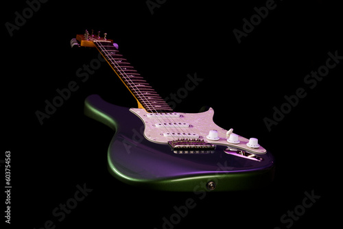 Stratocaster style electric guitar floating on black background